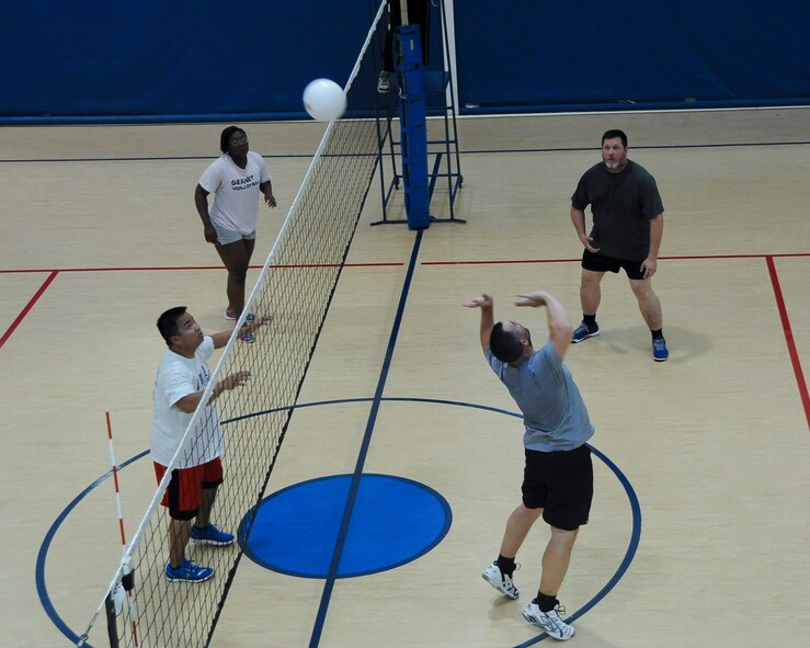 An Air Force Global Strike Command volleyball team sends the ball over to the 2nd Logistics Readiness Squadron volleyball team at Barksdale Air Force Base, La., Aug. 8, 2016. AFGSC has two teams competing this season. (U.S. Air Force photo/Airman 1st Class Stuart Bright)