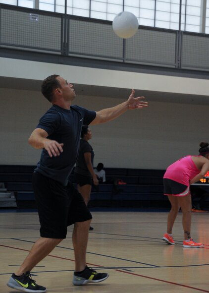 Justin Rushing, 2nd Logistics Readiness Squadron volleyball player, serves a volleyball to begin play during the first set against Air Force Global Strike Command Team One at Barksdale Air Force Base, La., Aug. 8, 2016. The 2nd LRS won the first set 25 to 18. (U.S. Air Force photo/Airman 1st Class Stuart Bright)