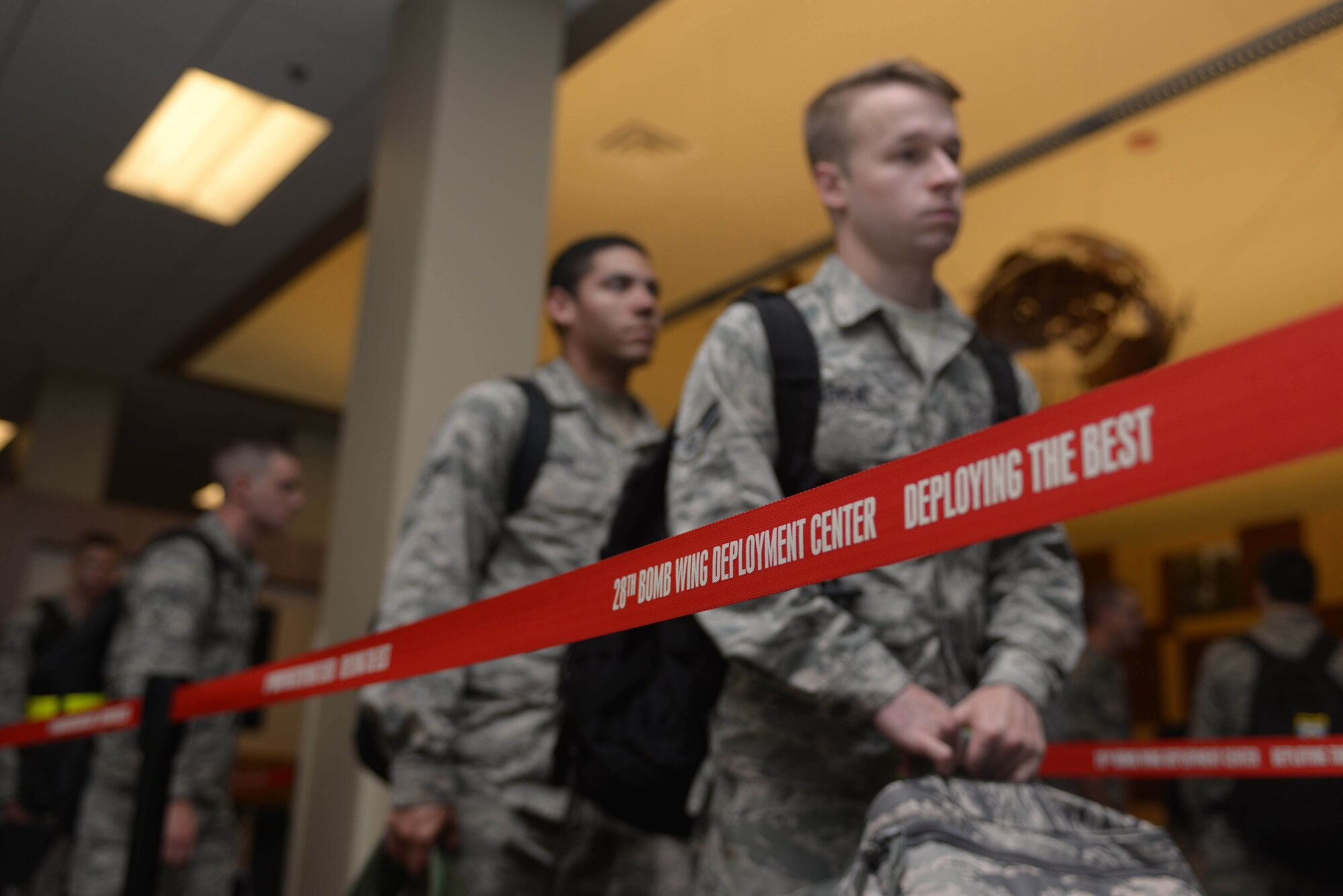 Airmen of the 28th Bomb Wing prepare for screening at Ellsworth Air Force Base, S.D., Aug. 9, 2016. The Airmen will support B-1 bomber missions as part of the U.S. Pacific Command’s continuous bomber presence mission. (U.S. Air Force photo by Airman Donald Knechtel)