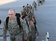 Airmen of the 28th Bomb Wing board a Boeing 737 aircraft at Ellsworth Air Force Base (AFB), S.D., Aug. 9, 2016. The Airmen will support B-1 bomber missions while deployed to Andersen AFB, Guam, as part of the U.S. Pacific Command’s continuous bomber presence mission. (U.S. Air Force photo by Airman Donald Knechtel)