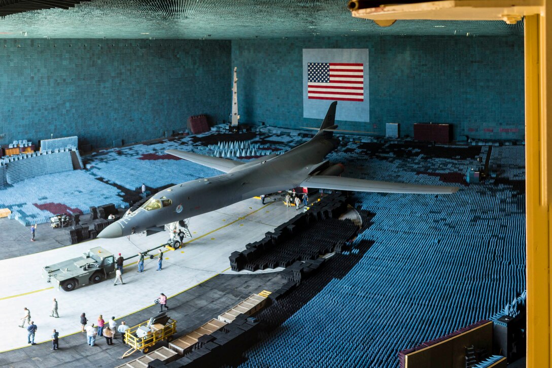 An Edwards B-1B sits on the 80-foot turntable in the Benefield Anechoic Facility July 27 after being towed inside. The chamber is filled with polyurethane and polyethylene pyramids designed to stop reflections of electromagnetic waves. The size of the pyramids, which are painted dark blue or black, varies depending on the particular frequency and test procedure being conducted. Aircraft systems can be tested and verified that they work properly prior to actual flight test. (U.S. Air Force photo by Christopher Okula)