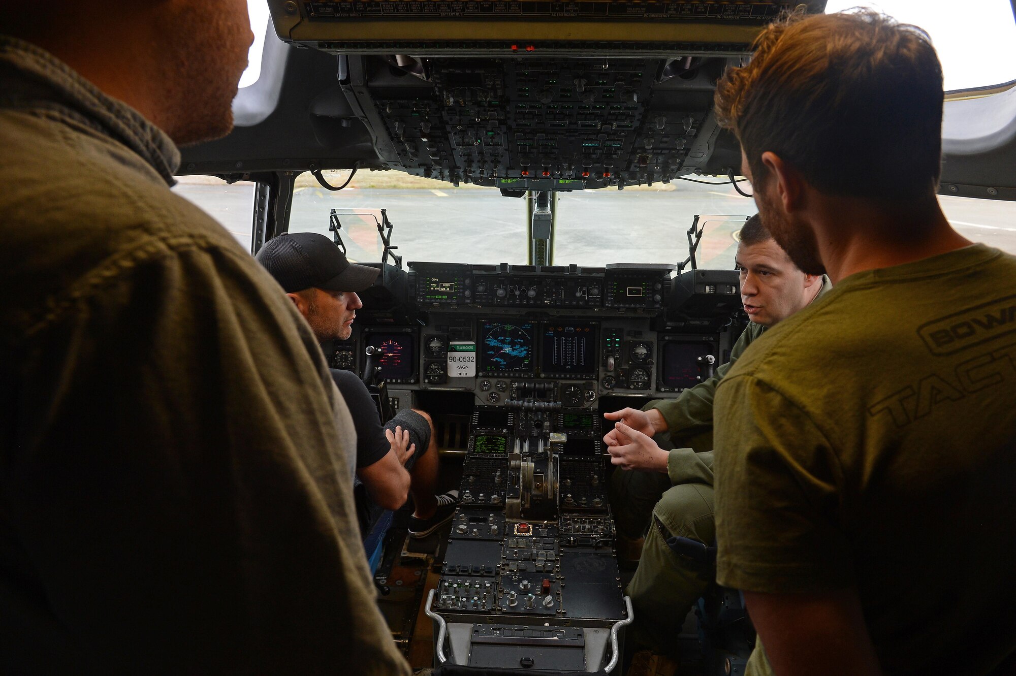 Craig Campbell, an American country music singer, sits in the cockpit of a McChord C-17 Globemaster III during his United Service Organization tour August 9, 2016 at Joint Base Lewis-McChord, Wash. While visiting McChord Field, Campbell had the opportunity to talk to 62nd Maintenance Group Airmen and loadmasters while touring a McChord C-17 Globemaster III. Later that day, as part of his tour, Campbell performed at Memorial Stadium on JBLM and thanked the men and women of JBLM for their service. (U.S. Air Force photo/Senior Airman Divine Cox)