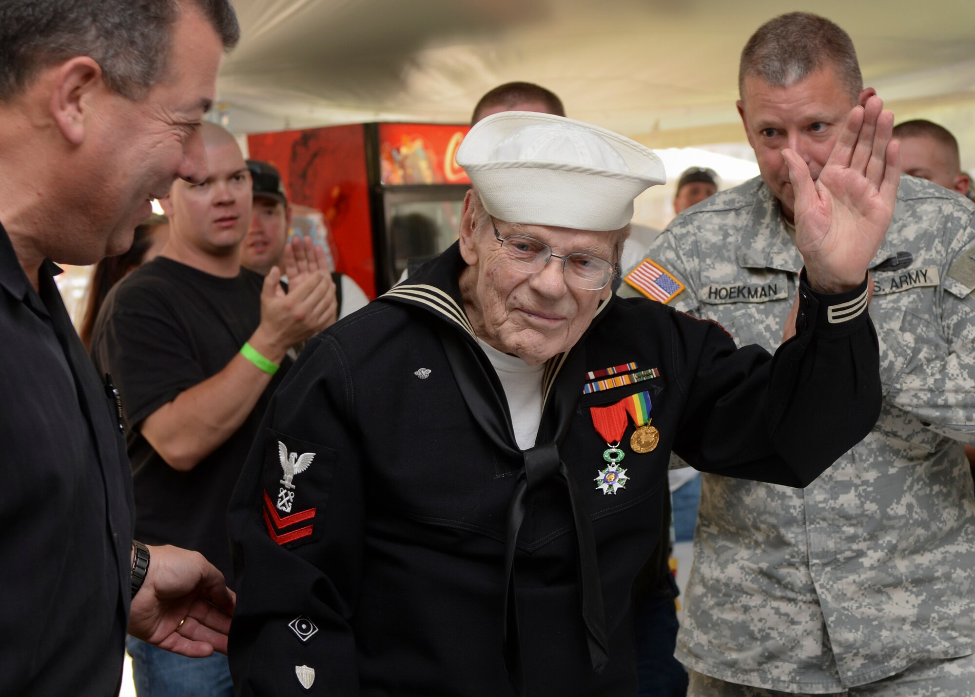 Gordon Lease, former Coast Guard Boatswains Mate, was one of two honored during a veterans recognition ceremony at Sturgis, S.D., Aug. 9, 2016. Lease is a WWII veteran who earned the Legion d’honneur, the highest French order for military and civil merits, for his support of the Normandy invasion where his crew transported 265 soldiers and sailors from the shoreline to England for medical treatment. (U.S. Air Force photo by Senior Airman Anania Tekurio/Released)