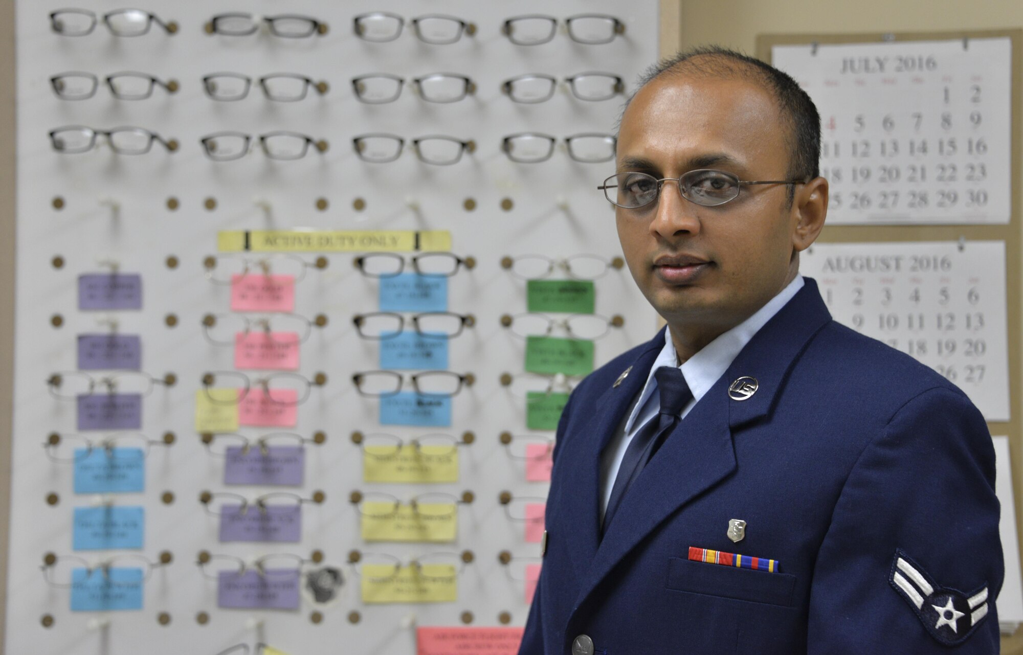 Airman 1st Class Pratik Bhatt, 60th Aerospace Medicine Squadron optometry technician, poses for a photo at Travis Air Force Base, Calif., Aug. 1, 2016. (U.S. Air Force photo by Senior Airman Amber Carter)