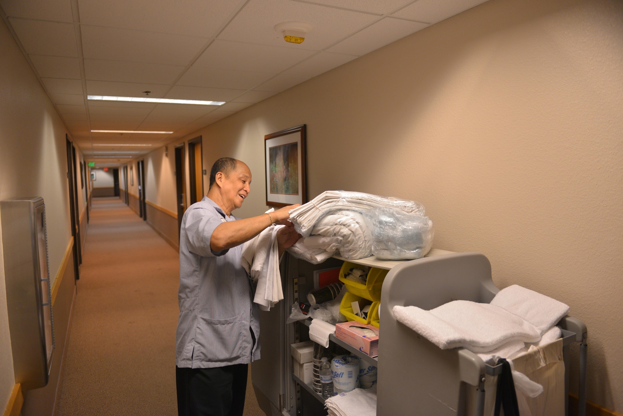 Gary Salas, a Gold Rush Inn housekeeper with the 354th Force Support Squadron, gets new sheets for a guest, Aug. 9, 2016, during RED FLAG-Alaska 16-3, on Eielson Air Force Base, Alaska. Aside from daily maintenance, Gold Rush Inn housekeepers can clean more than 20 rooms per day. (U.S. Air Force photo by Airman Isaac Johnson)