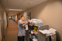Gary Salas, a Gold Rush Inn housekeeper with the 354th Force Support Squadron, gets new sheets for a guest, Aug. 9, 2016, during RED FLAG-Alaska 16-3, on Eielson Air Force Base, Alaska. Aside from daily maintenance, Gold Rush Inn housekeepers can clean more than 20 rooms per day. (U.S. Air Force photo by Airman Isaac Johnson)