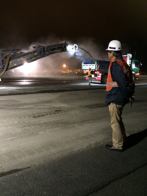 A construction crew works late into the night to pour asphalt on the flightline at Misawa Air Base, Japan.  The construction plays a vital role, ensuring the continuation of the 35th Fighter Wing’s mission of providing worldwide deployable forces. (Courtesy photo)
