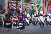 Tanabata Dancers participate in a parade during the 66th Annual Fussa Tanabata Festival at Fussa City, Japan, Aug. 5, 2016. The Tanabata Dancers, from Yokota Air Base, perform at local festivals in order to promote goodwill and cultural exchange between the U.S. and Japan. (U.S. Air Force photo by Staff Sgt. Cody H. Ramirez/Released)