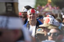 An Airman from Yokota Air Base takes a break from carrying a mikoshi, or portable shrine, during the 66th Annual Fussa Tanabata Festival at Fussa City, Japan, Aug. 5, 2016. Nearly 100 members of Yokota participated in carrying the mikoshi, giving the Air Force base an active role in the Japanese festival. (U.S. Air Force photo by Staff Sgt. Cody H. Ramirez/Released)
