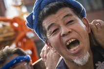A man carries a mikoshi, or portable shrine, during the 66th Annual Fussa Tanabata Festival at Fussa City, Japan, Aug. 5, 2016. Traditionally, the mikoshi were believed to carry Shinto gods through the city, cleansing the streets of evil spirits. Today, mikoshi represent collectivity and the overcoming of hardships. (U.S. Air Force photo by Staff Sgt.
Cody H. Ramirez/Released)
