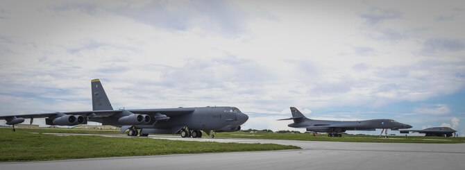 A B-52 Stratofortress, B-1 Lancer and B-2 Spirit sit next to each other on the flightline at Andersen Air Force Base, Guam, Aug.10, 2016. All three of Air Force Global Strike Command's strategic bomber aircraft are simultaneously conducting operations in the U.S. Pacific Command area of operations. The B-1 Lancer arrived at Andersen Aug. 6 to support U.S. Pacific Command’s Continuous Bomber Presence mission and rotate with the B-52s there. In addition, three B-2s arrived in theater to conduct a Bomber Assurance and Deterrence deployment. The CBP and BAAD missions are part of a long-standing history of maintaining a consistent bomber presence in the Indo-Asia-Pacific in order to maintain regional stability. (U.S. Air Force photo by Tech. Sgt. Richard Ebensberger)