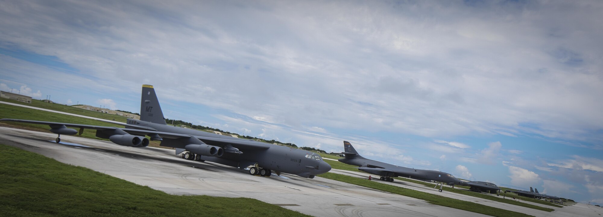 A B-52 Stratofortress, B-1 Lancer and B-2 Spirit sit beside one another on the flightline at Andersen Air Force Base, Guam, Aug.10, 2016. This marks the first time in history that all three of Air Force Global Strike Command's strategic bomber aircraft are simultaneously conducting operations in the U.S. Pacific Command area of operations. The B-1 Lancer, which arrived at Andersen Aug. 6, will replace the B-52 in support of the U.S. Pacific Command Continuous Bomber Presence mission. The CBP bomber swap between the B-1 and B-52 is occurring throughout the month of August as the B-1s return to support this mission for the first time since April 2006. In addition to the CBP bomber swap, three B-2s arrived in theater to conduct a Bomber Assurance and Deterrence deployment. The CBP mission and BAAD deployments are part of a long-standing history of maintaining a consistent bomber presence in the Indo-Asia-Pacific in order to maintain regional stability, and provide assurance to our allies and partners in the region. (U.S. Air Force photo by Tech. Sgt. Richard Ebensberger)