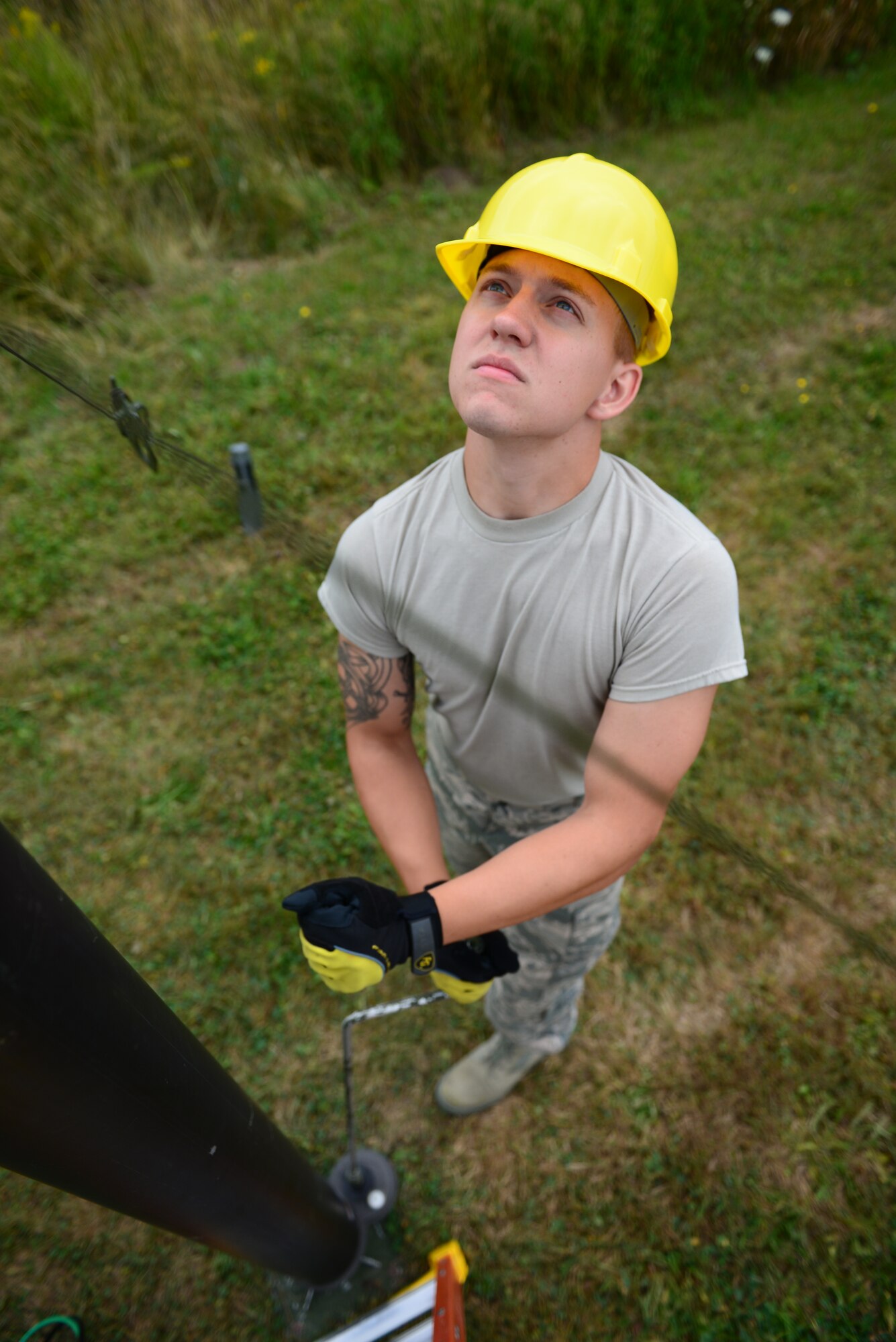 Senior Airman Matthew Barricklow with the 157th Communications Flight, New Hampshire Air National Guard, adjusts the height of a radio communication antenna during a training exercise at the New Hampshire Air National Guard Training Site in Center Stratford, N.H., Aug. 6. The antenna was part of the Joint Incident Site Communications Capability (JISCC) that was used to execute the exercise in support of domestic operations. (Air National Guard photo by Senior Airmen Kayla McWalter)