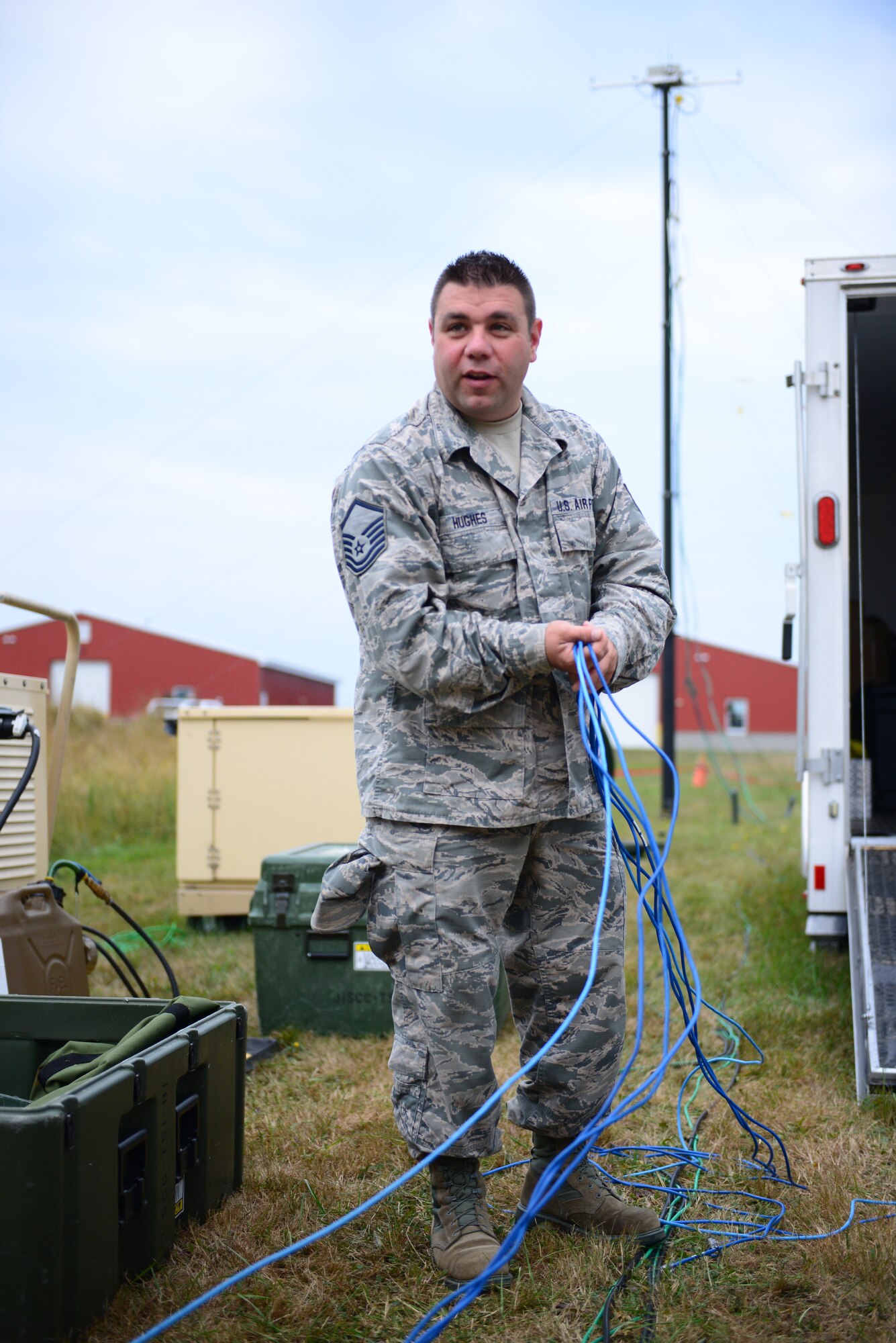 Master Sgt. Adam Hughes with the 157th Communications Flight, New Hampshire Air National Guard, organizes cables that were removed from the Joint Incident Site Communications Capability, JISCC.  The JISCC provides voice, data, video and radio links between first responders and other local, state and federal agencies. (Air National Guard photo by Senior Airmen Kayla McWalter)  