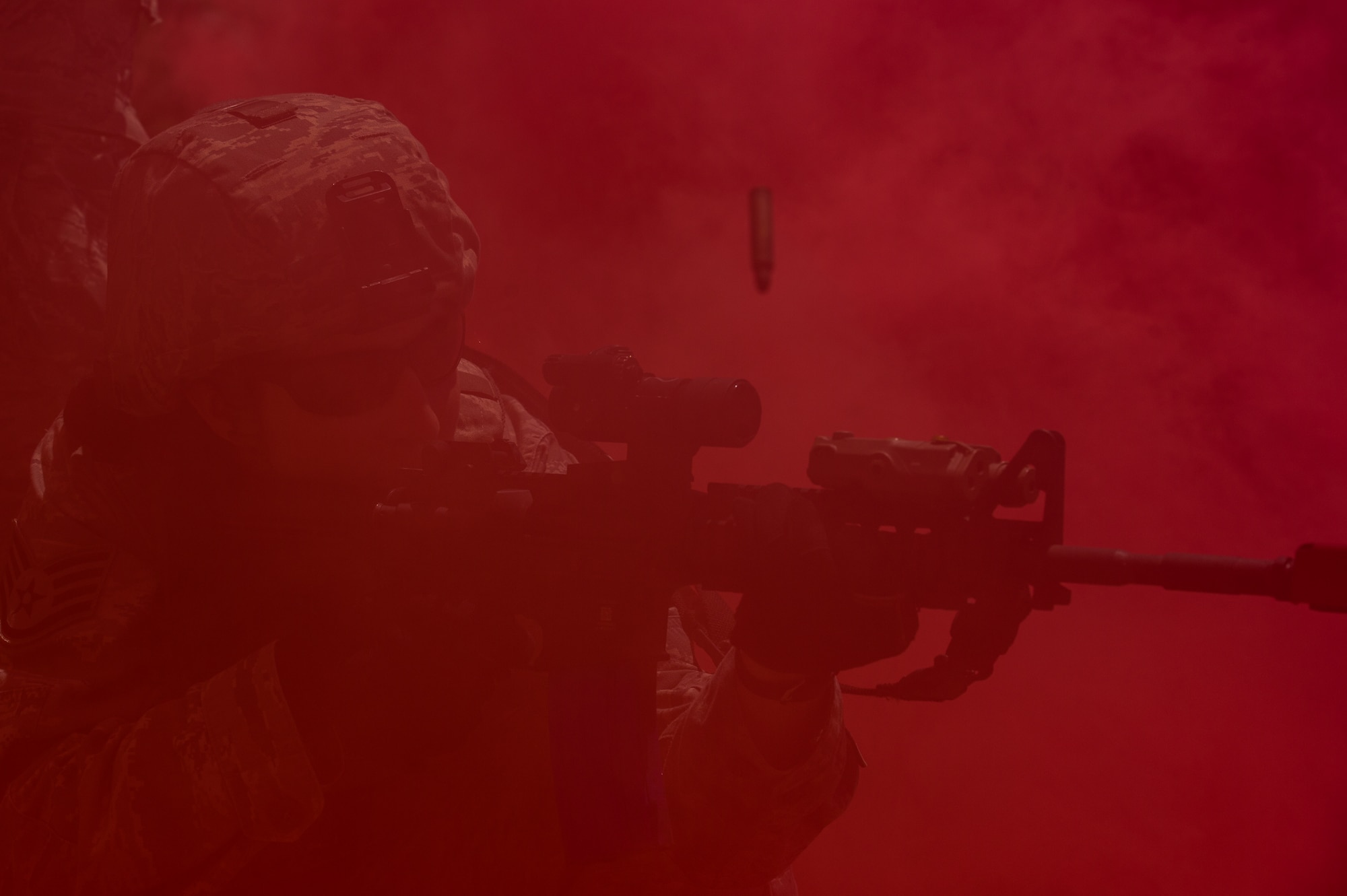 Staf Sgt. Courtney McClellan, 137th Security Forces Squadron, returns fire during a simulated urban terrain exercise at Camp Gruber Training Center near Braggs, Okla., Aug. 3, 2016. Approximately 40 members of the 137 SFS completed annual training from July 29 to Aug. 5, 2016. Airmen engaged in extensive training exercises including:  close combat training, weapons training, military operations on urban terrain and navigation training. (U.S. Air National Guard photo by Senior Airman Tyler Woodward/Released)