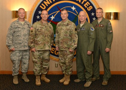 U.S. Army Maj. Gen. James H. Dickinson (center), U.S. Strategic Command (USSTRATCOM) chief of staff, welcomes U.S. Army National Guard Maj. Gen. Timothy Orr (second from left), state of Iowa adjutant general, and members of his staff to USSTRATCOM headquarters, Offutt Air Force Base, Neb., Aug. 10, 2016. During his orientation visit, Orr held discussions with USSTRATCOM senior leaders and received briefings on the commandâ€™s facilities, missions and assets. He also toured a National Airborne Operations Center aircraft. One of nine DoD unified combatant commands, USSTRATCOM has global strategic missions assigned through the Unified Command Plan, which include strategic deterrence; space operations; cyberspace operations; joint electronic warfare; global strike; missile defense; intelligence, surveillance and reconnaissance; combating weapons of mass destruction; and analysis and targeting. Also pictured are U.S. Air Force National Guard Brig. Gen. Drew DeHaes (second from right), state of Iowa assistant adjutant general-Air; Col. Shawn Ford (right), Iowa Air National Guard 132nd Wing commander, Des Moines, Iowa; and Col. Larry Christensen, Iowa Air National Guard 185th Air Refueling Wing commander, Sioux City, Iowa. (USSTRATCOM photo by U.S. Air Force Staff Sgt. Jonathan Lovelady)