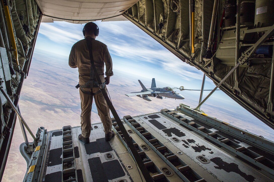 Marine Corps Cpl. Chris Lawler observes an F/A-18C Hornet  approach the refueling hose during Exercise Pitch Black 2016 at Royal Australian Air Force Base Tindal, Australia, Aug. 9, 2016. The  Australian air force hosted the multinational, large-force training exercise. Marine Corps photo by Cpl. Nicole Zurbrugg