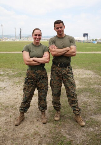 U.S. Marine Corps 2nd Lt. Melissa Heisterberg, left, deputy director of public affairs, Headquarters and Headquarters Squadron, and U.S. Marine Corps Sgt. Michael Eckert, quality control chief of motor transport company, Marine Wing Support Squadron 171, pose after winning the preliminary High Intensity Tactical Training Athlete Competition at Marine Corps Air Station Iwakuni, Japan, June 17, 2016. Heisterberg and Eckert are the top contenders from the air station to attend the Second Annual HITT Ultimate Athlete Championship from Aug. 15-18, 2016, at MCAS Miramar, California. They will battle against nearly three dozen other U.S. Marines in one of the most difficult fitness competitions in the Marine Corps. (U.S. Marine Corps photo by Sgt. Jessica Quezada)
	
