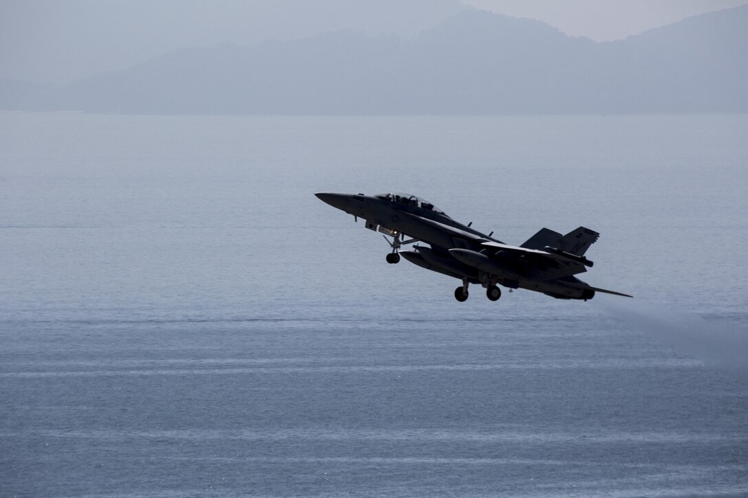 A U.S. Navy EA-18G Growler from Electronic Attack Squadron (VAQ) 141 with Carrier Air Wing (CVW) 5 out of Naval Air Facility Atsugi, Japan, conducts flight operations near Marine Corps Air Station Iwakuni, Japan, Aug. 11, 2016. The flight, observed by the Iwakuni City mayor as well as members of the press and public, provided observers some insight to the operational nature of the Growler. Carrier Air Wing 5 is expected to transition from its present home station, NAF Atsugi, to MCAS Iwakuni in the coming years. (U.S. Marine Corps photo by Cpl. Nathan Wicks)