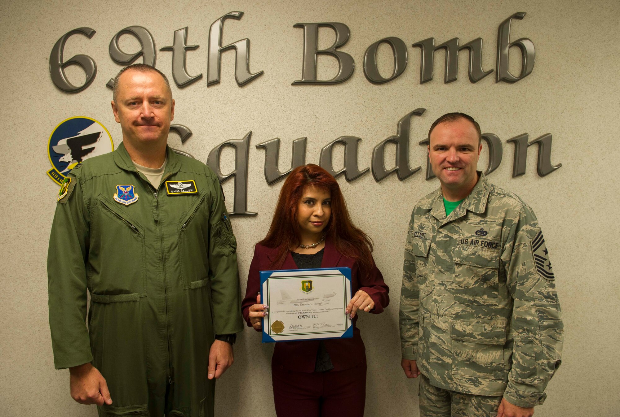 Ermelinda Torres, 69th Bomb Squadron command support staff, receives the 5th Bomb Wing "Own It" Award at Minot Air Force Base, N.D., Aug. 5, 2016. Torres overhauled squadron in-processing procedures, allowing new members to expeditiously start Mission Qualification Training.  She processed more than 70 performance reports, awards, decorations, and promotion recommendation forms and streamlined OPR and EPR processes, personally ensuring that squadron records are current and that members are promotion board-ready, while decreasing the submission timeline by over 50 percent. Finally, Mrs. Torres selflessly donated her time to support the Airman's Attic, enhancing
quality of life for Minot AFB Airmen and exemplifying the definition of "Own It" both on- and off-duty.

