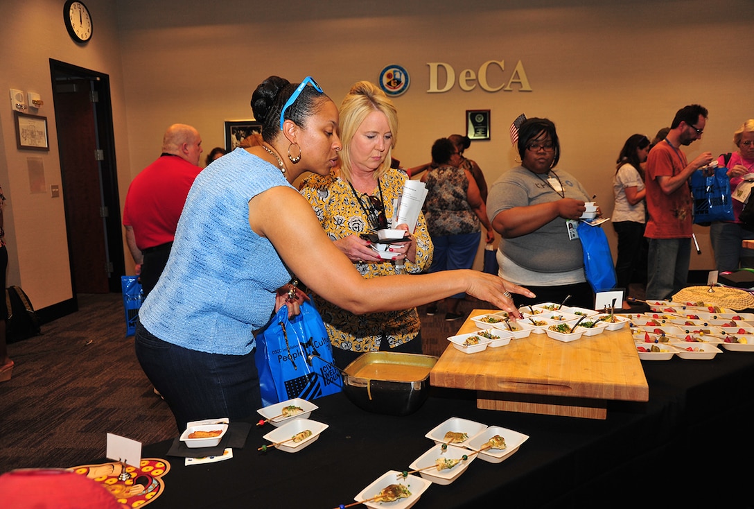 Associates sample one of many cultural delicatessens offered by special emphasis groups during Defense Supply Center Columbus’ 2016 Installation People and Culture Day. The Aug. 3 event was coordinated by the Defense Finance Accounting Services and Defense Logistics Agency special emphasis programs and the DSCC Family Morale Welfare and Recreation program.  