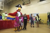 Hundreds of active duty service members and their children attended the Kids Day event. Activities for the children included bounce houses, football and baseball tosses, kid’s dance party and display tables that allowed them to try new and different types of food.