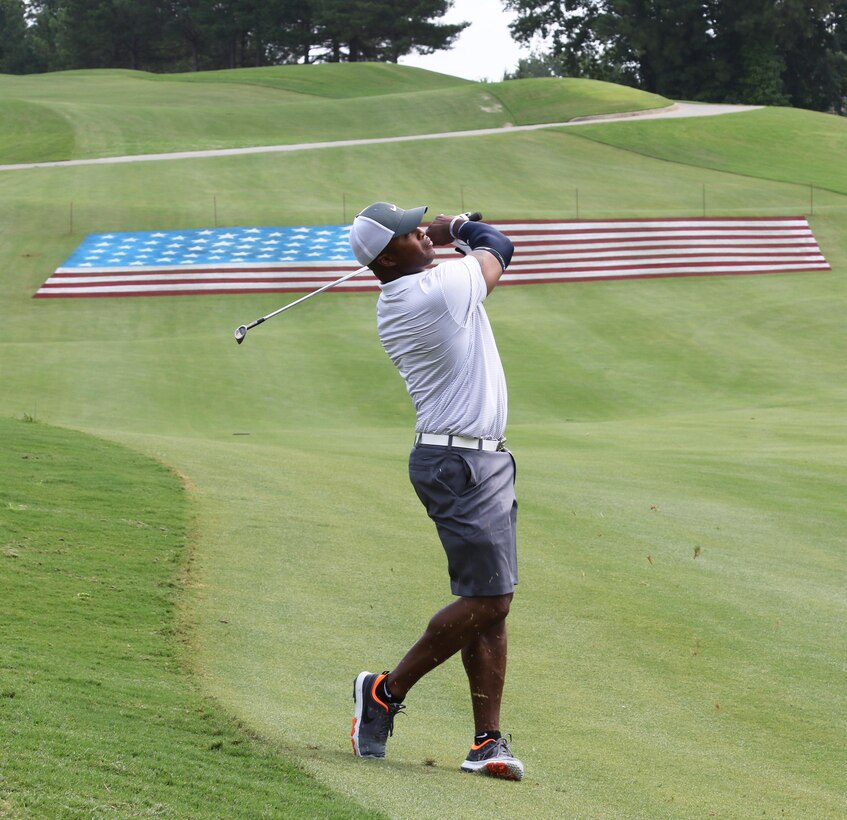 Army Reserve Master Sgt. Gregory Mathis, noncommissioned officer in charge of information technology, assigned to Headquarters and Headquarters Company, 335th Signal Command (Theater) watches his golf ball fly toward the green on Hole 18 during a fund-raising golf tournament Aug. 5, at the Tournament Players Club (TPC) Sugarloaf, in Duluth, Georgia.  The event called “Birdies for the Brave”, is a national military outreach initiative dedicated to honoring and showing appreciation to the courageous men and women of the United States Armed Forces and their families.  Originally created in 2006 by one of the golfing world’s elite players, Phil Mickelson and his wife Amy, it has since been expanded to include military outreach and appreciation activities during PGA tour events, TPCs and partner courses across the nation.