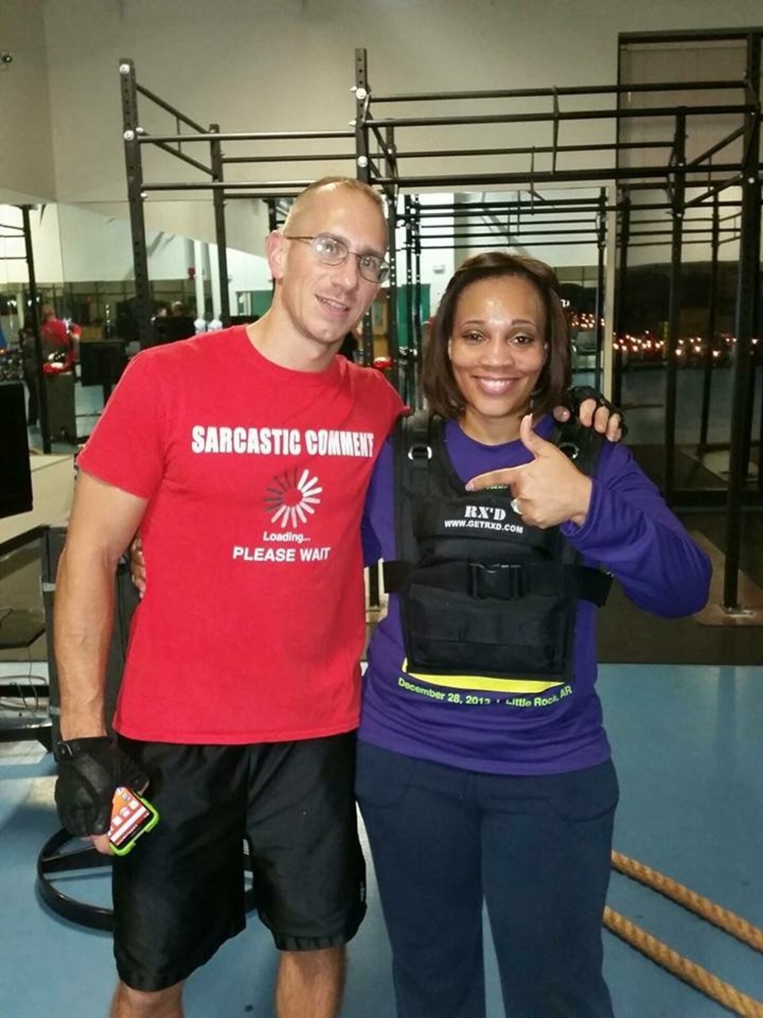 Chandra Erskine shares a picture with Tech. Sgt. Toby Walton, former 314th Aircraft Maintenance Squadron member and Vital 90 instructor, July 31, 2016 at the Little Rock Air Force Base gym. In two and one-half years, Erskine lost110 pounds. (courtesy photo)