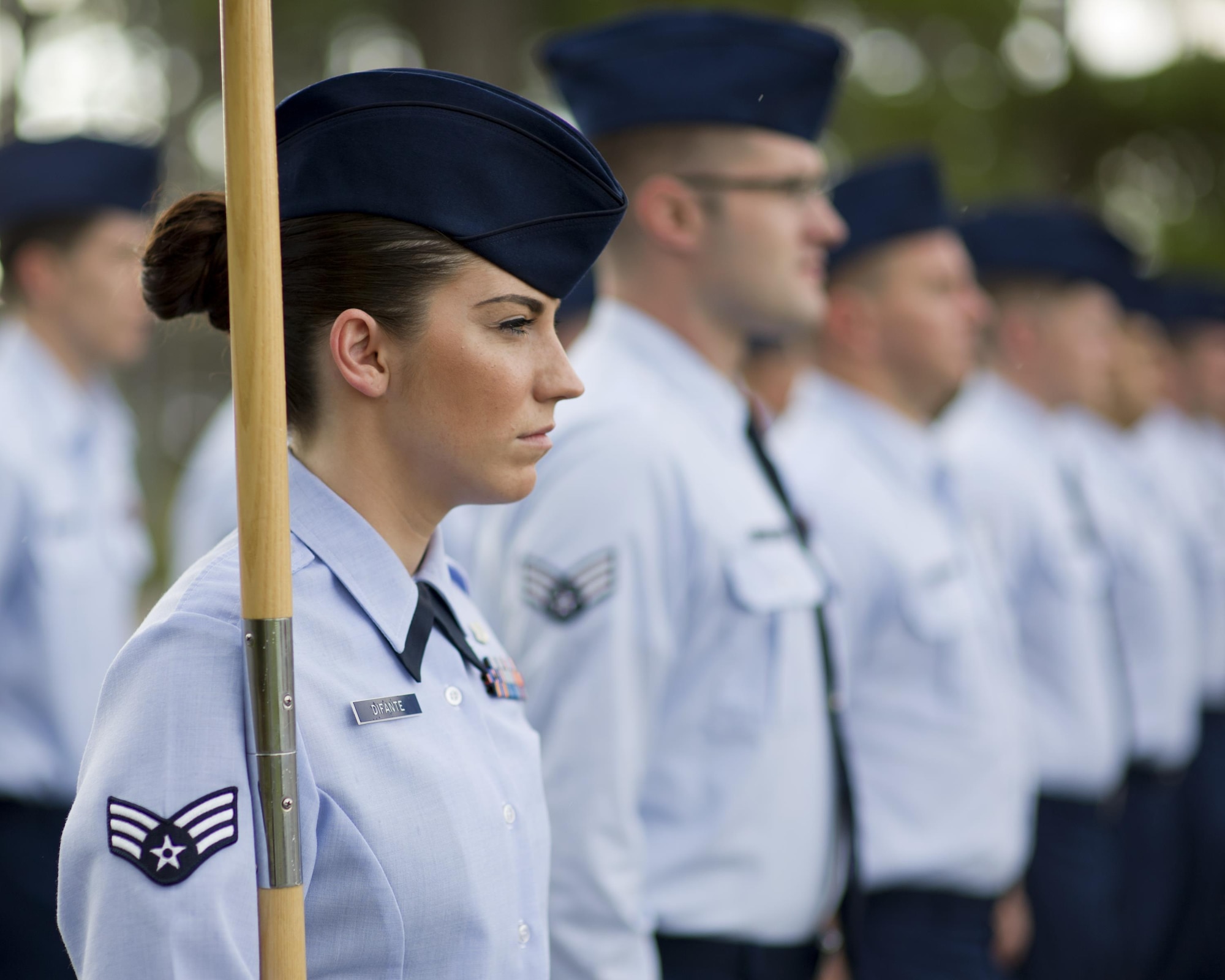 U.S. Air Force Senior Airman Lauren Difante, Tyndall Airman Leadership School student, bears the ALS class guidon during Reveille at Tyndall Air Force Base, Fla., Aug. 8, 2016. During professional military education at ALS, students begin the transition into first-line supervisors through a curriculum focused on leadership theory and employment. (U.S. Air Force photo by Staff Sgt. Alex Fox Echols III/Released)