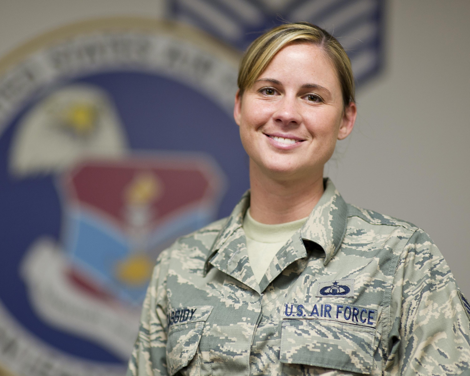 U.S. Air Force Staff Sgt. Stephanie Cassidy, 325th Force Support Squadron Airman Leadership School instructor, stands in the ALS auditorium at the Tyndall Air Force Base Education Center, Aug. 9, 2016. Cassidy worked in air traffic control before becoming an ALS instructor. (U.S. Air Force photo by Staff Sgt. Alex Fox Echols III/Released)
