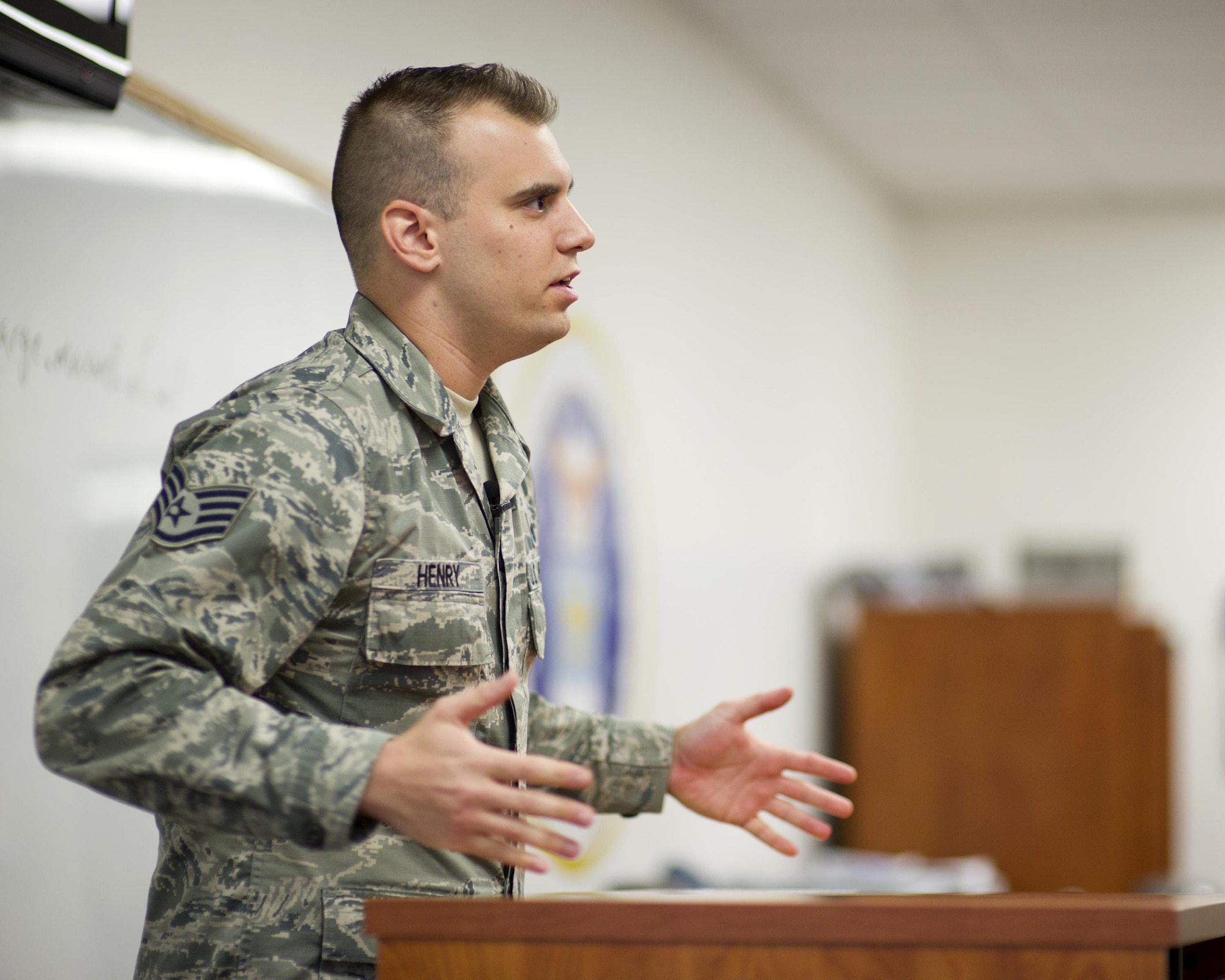 U.S. Air Force Staff Sgt. Joshua Henry, 325th Force Support Squadron Airman Leadership School instructor, teaches a class at the Tyndall Air Force Base Education Center, Aug. 9, 2016. Each year, the instructors graduate roughly 290 students in seven or more classes with about 40 students per class. (U.S. Air Force photo by Staff Sgt. Alex Fox Echols III/Released)