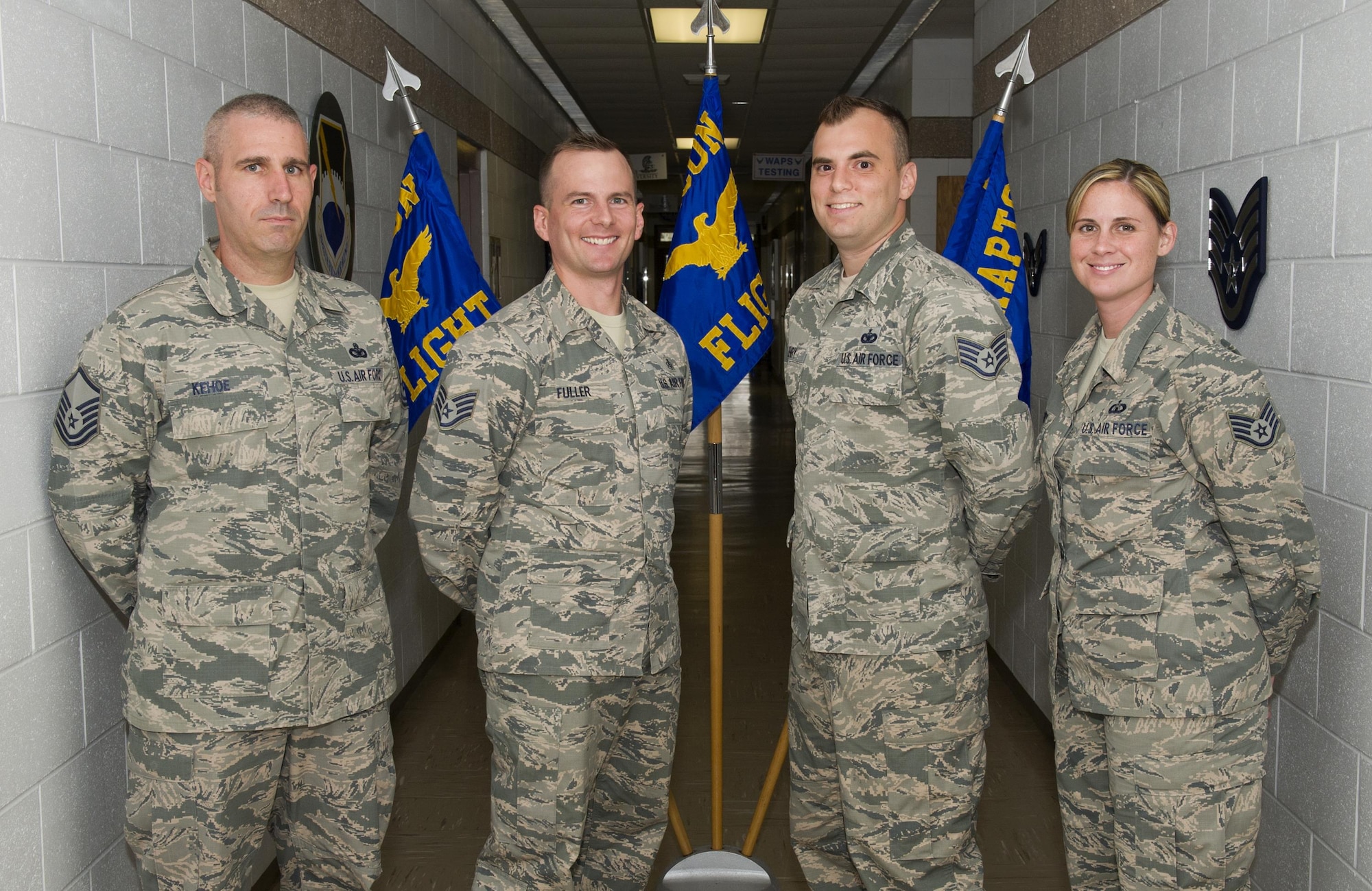 U.S. Air Force Master Sgt. Nicholas Kehoe, 325th Force Support Squadron Airman Leadership School commandant, and Staff Sgts. Jordan Fuller, Joshua Henry and Stephanie Cassidy, 325th FSS ALS instructors, stand together at the Tyndall Air Force Base Education Center, Aug. 10, 2016. Instructors at Tyndall’s ALS are charged with teaching their students how to lead Airmen through lessons in leadership theory, effective communication, resource stewardship and physical fitness. (U.S. Air Force photo by Staff Sgt. Alex Fox Echols III/Released)