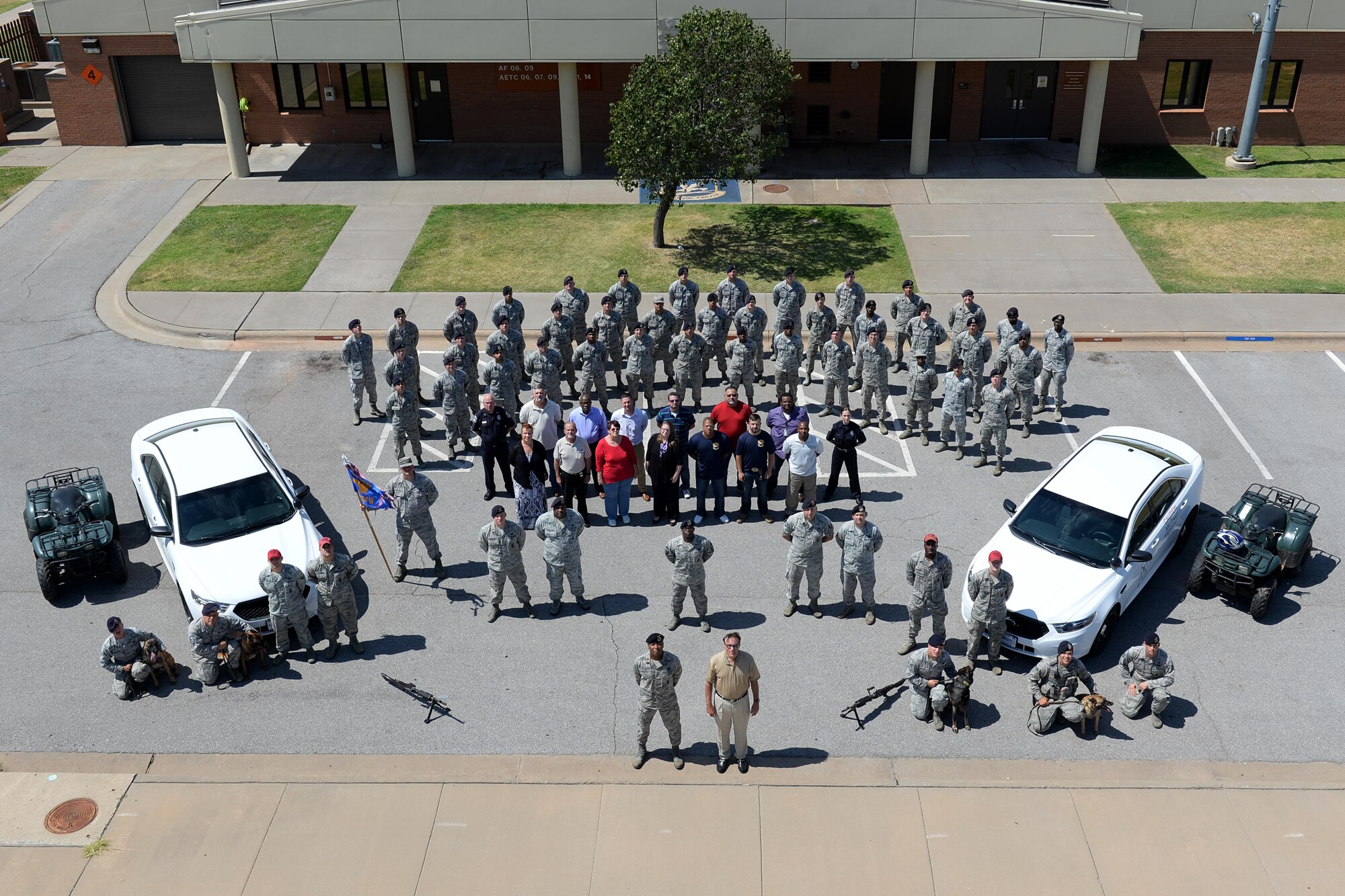 Airmen from the 82nd Security Forces Squadron pose for a group photo at Sheppard Air Force Base, Texas, Aug. 5, 2016, just after the return of nearly 25 Airman who were deployed to Southwest Asia. The Airmen deployed in support of Operation Enduring Freedom and provided, base defense, weapons system security, force protection and security for nearly two to three billion dollars in assets. (U.S. Air Force photo by Senior Airman Kyle E. Gese/Released)