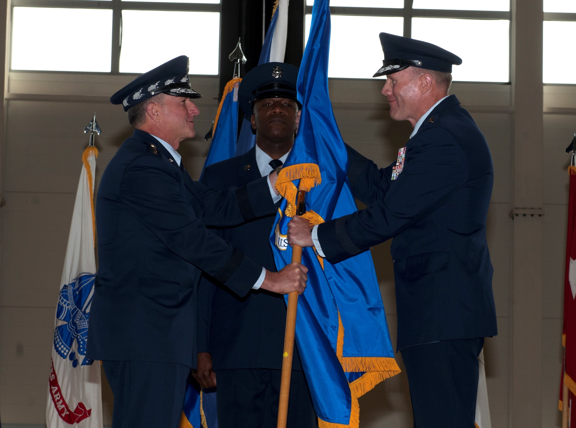 Air Force Chief of Staff Gen. David Goldfein presents Gen. Tod Wolters the U.S. Air Forces in Europe and Air Forces Africa guidon during a change of command ceremony at Ramstein Air Base, Germany, Aug. 11, 2016. Wolters is coming from an assignment as the director of operations on the joint staff at the Pentagon. USAFE-AFAFRICA executes the Air Force, U.S. European Command and U.S. Arica Command missions with forward-based airpower and infrastructure to conduct and enable theater and global operations.  (U.S. Air Force photo/Airman 1st Class Tryphena Mayhugh)