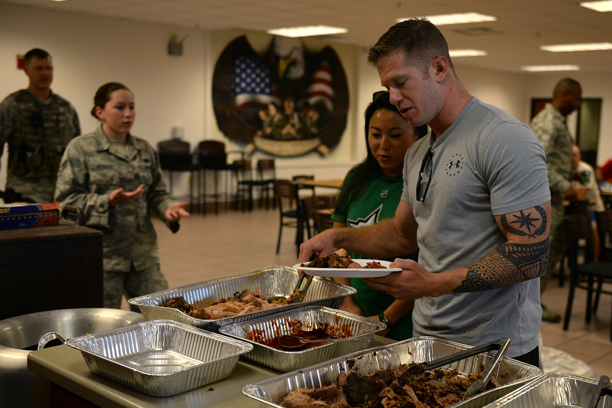Senior Airman Matthew Fagnani, 82nd Security Forces defender, and his wife Andrea, attended a welcome home lunch at Sheppard Air Force Base, Texas, Aug. 5, 2016, for nearly 25 Airmen who were deployed to Southwest Asia. The Airmen deployed in support of Operation Enduring Freedom and provided, base defense, weapons system security, force protection and security for nearly two to three billion dollars in assets. (U.S. Air Force photo by Senior Airman Kyle E. Gese/Released)