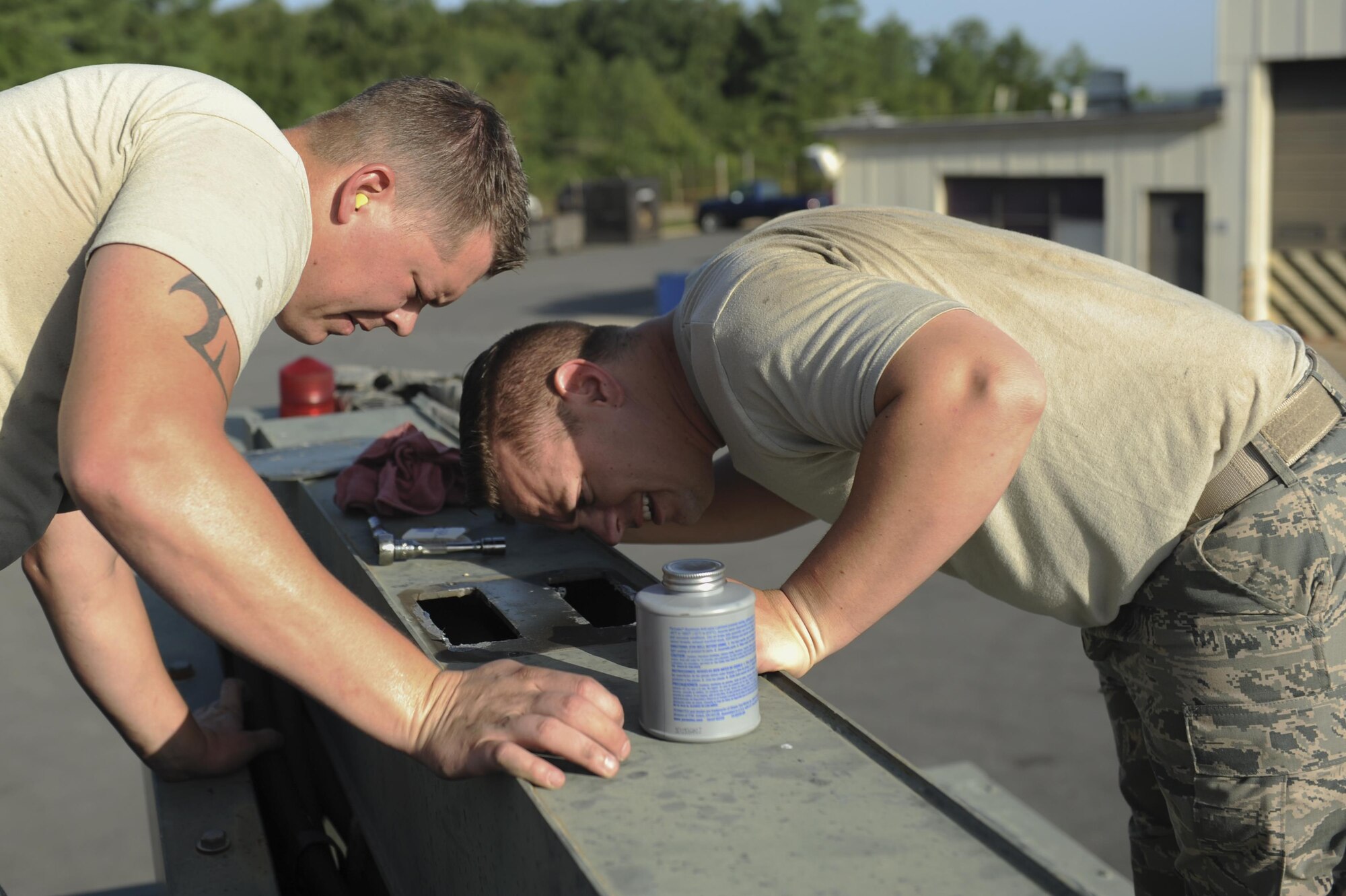 (From left) U.S. Air Force Staff Sgt. Ryan Ayres and U.S. Air Force Tech. Sgt. Terry Carr, 19th Logistics Readiness Squadron Mission Generation Vehicular Equipment Maintenance craftsmen, examines a vehicle deicer Aug. 3, 2016, at the 19th LRS Vehicle Maintenance shop, on Little Rock Air Force Base, Ark. The checks ensure the timing on the vehicle is accurate; proper timing prevents the hydraulic functions from moving too fast and having the potential to blow seals in the hydraulic system. (U.S. Air Force photo by Airman Grace Nichols)