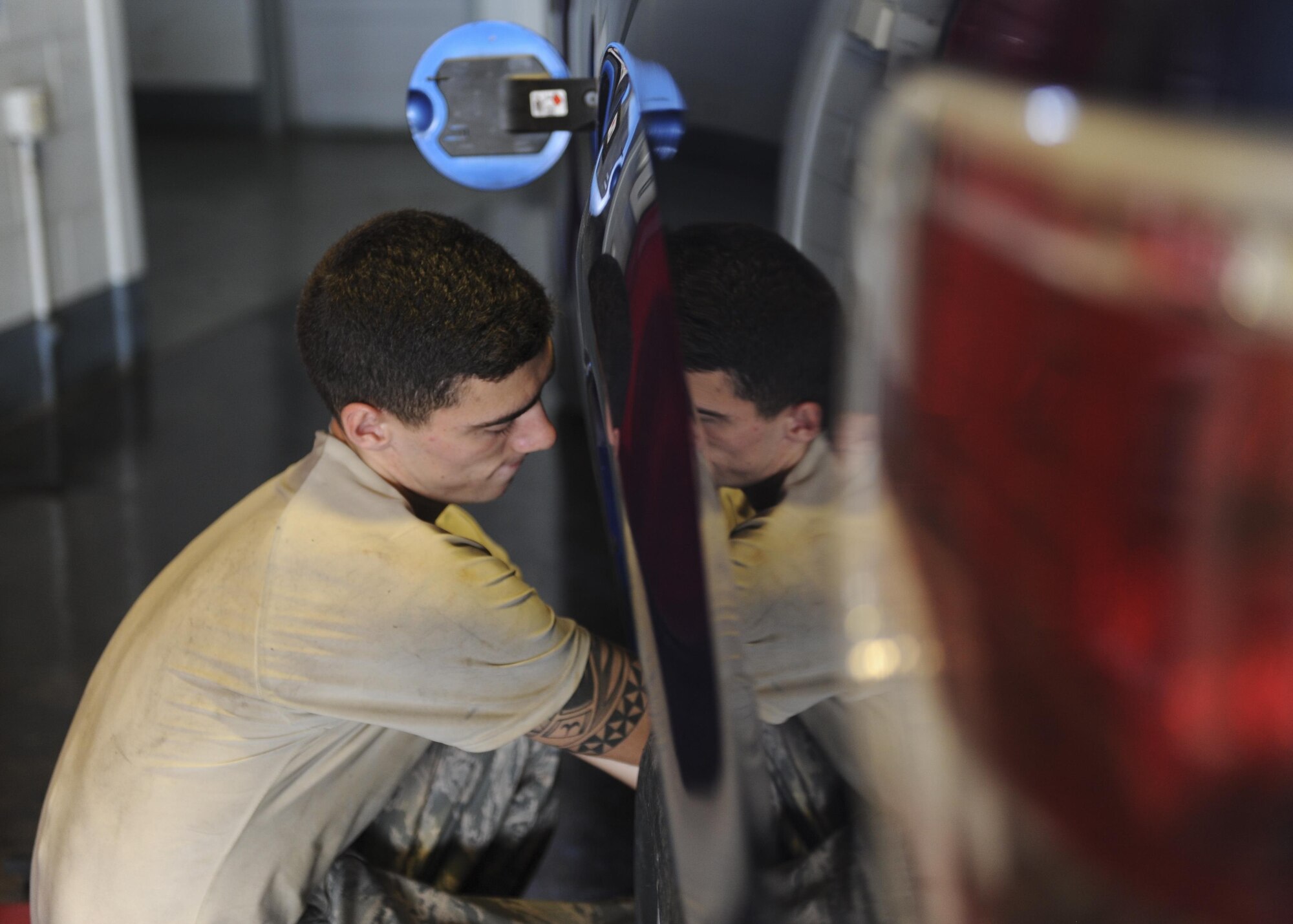 U.S. Air Force Airman 1st Class Javier Nunezchaves, 19th Logistics Readiness Squadron Mission Generation Vehicular Equipment Maintenance apprentice, replaces a fuel filler neck on a truck Aug. 3, 2016, at the 19th LRS Vehicle Maintenance shop, on Little Rock Air Force Base, Ark. Repairs were done to correct dry rot, which was causing fuel leakage during pumping. (U.S. Air Force photo by Airman Grace Nichols)