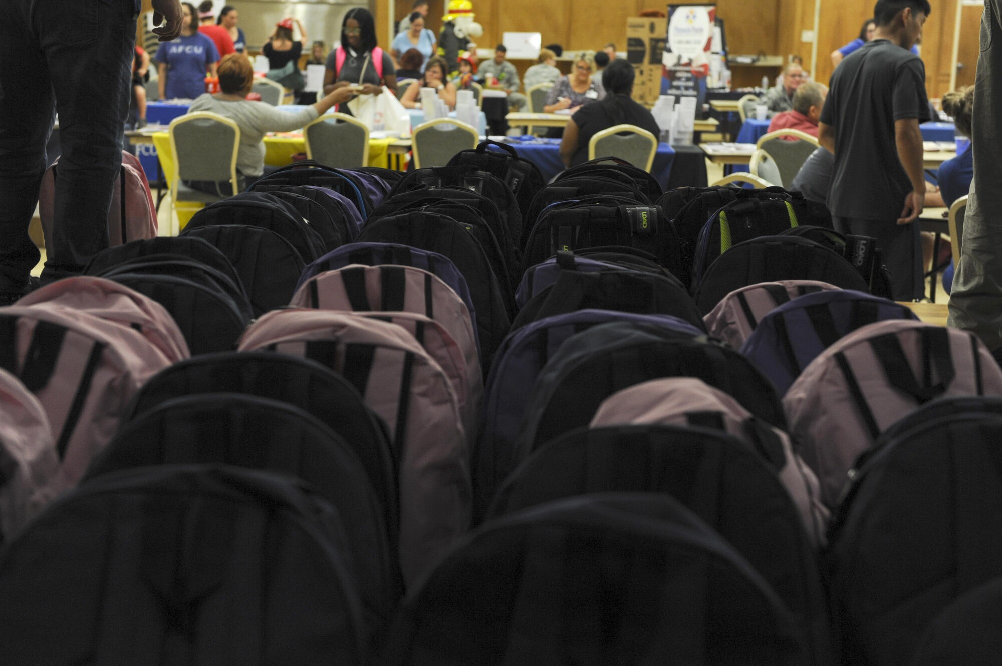 Backpacks filled with school supplies are laid-out in preparation of being distributed to military children as part of Operation Homefront’s Back-to-School Brigade event Aug. 5, 2016, at the Walters Community Support Center on Little Rock Air Force Base, Ark. By reaching out to active-duty military families of E-1 through E-6, Operation Homefront hopes to relieve some of the financial stressors associated with military family life. (U.S. Air Force photo by Airman Grace Nichols)