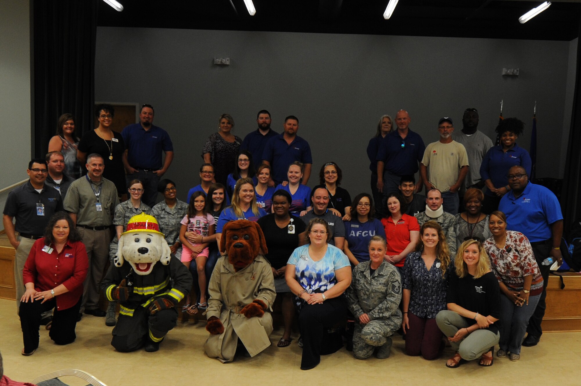 Volunteers from Team Little Rock gather together in celebration of Operation Homefront’s Back-to-School Brigade event Aug. 5, 2016, at the Walters Community Support Center on Little Rock Air Force Base, Ark. In 2015, more than 25,000 backpacks filled with school supplies were given to military children across the country because of Operation Homefront’s Back-to-School Brigade. (U.S. Air Force photo by Airman Grace Nichols)