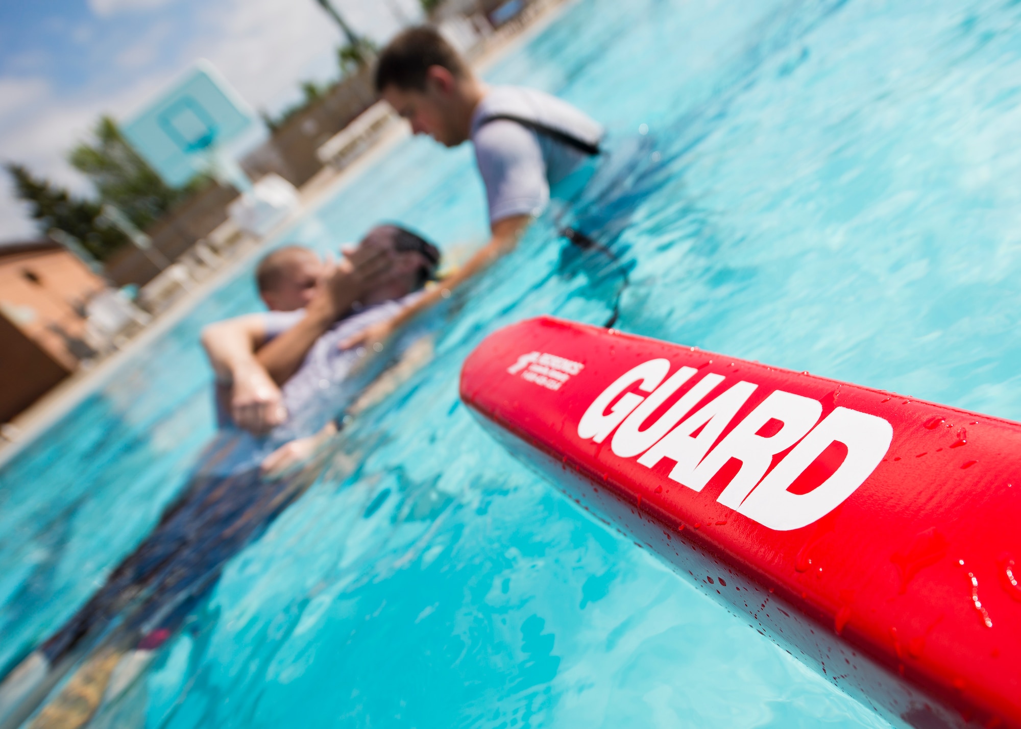 A lifeguard buoy floats in the base pool during the 5th Medical Operation Squadron’s water extraction training at Minot Air Force Base, N.D., Aug. 10, 2016. The lifeguard buoys are used to help keep the water rescue board afloat while the patient is being extracted from the water. (U.S. Air Force photo/Airman 1st Class J.T. Armstrong)