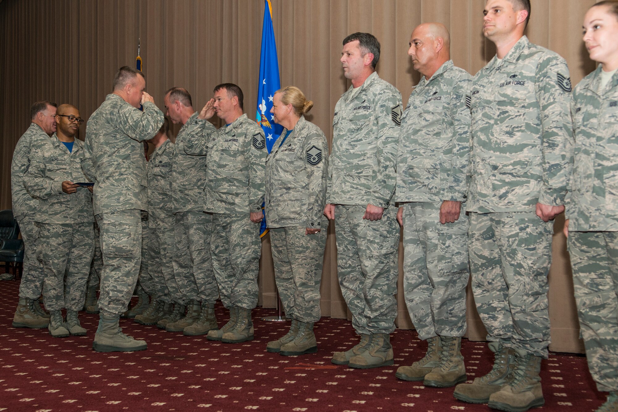 U.S. Air Force Col. Bruce Cox, 307th Bomb Wing commander, congratulates Airmen assigned to the 307th Maintenance Group Quality Assurance section for being recognized as Capstone Superior Performers during a commander’s call on Aug. 7, 2016, Barksdale Air Force Base, La. The Unit Effectiveness Inspection Capstone is conducted by the Air Force Reserve Command’s Inspector General team, which visits units throughout the command to get a more realistic picture of each unit’s mission effectiveness. (U.S. Air Force photo by Master Sgt. Greg Steele/Released)
