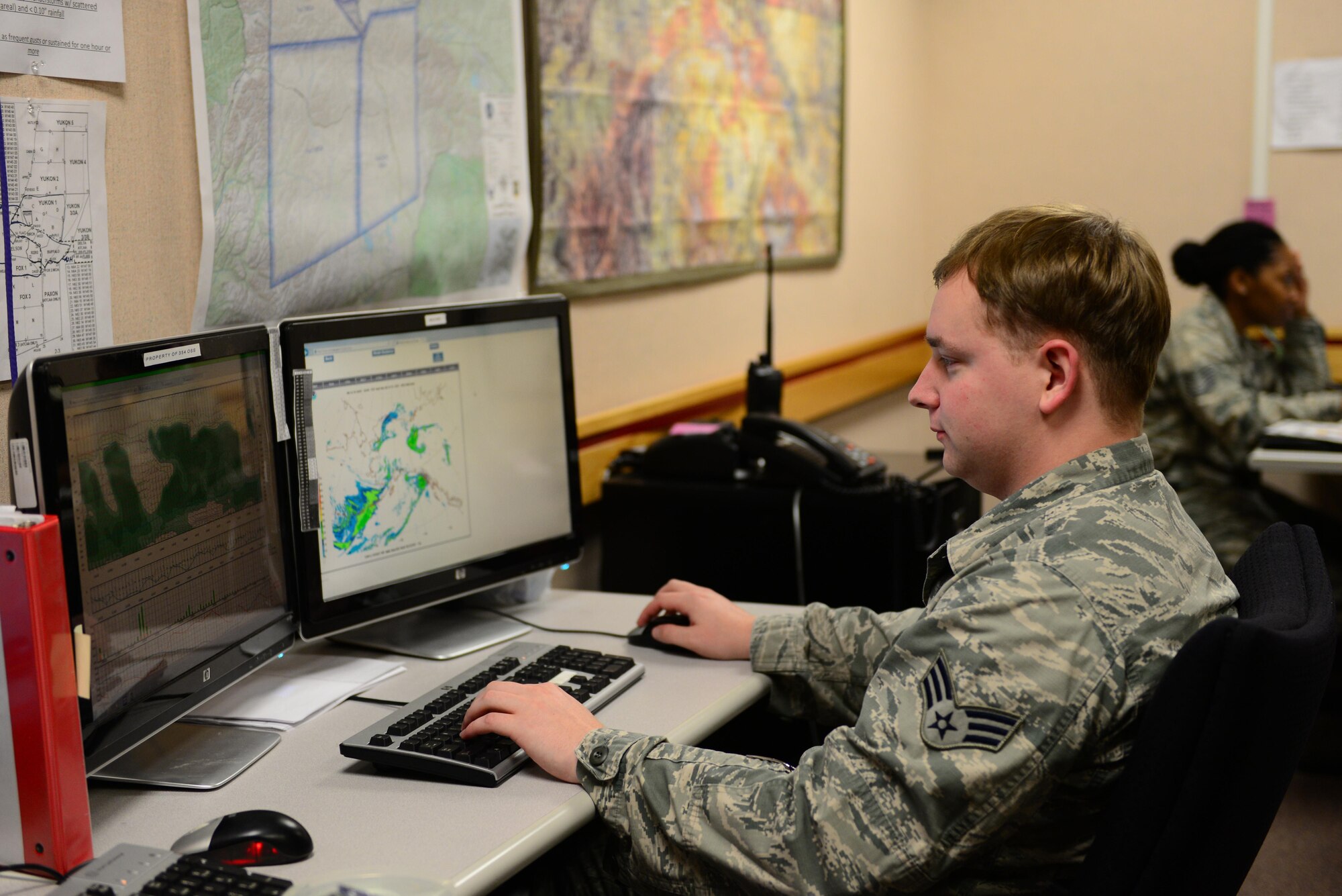 U.S. Air Force Senior Airman Drew Davies, a weather forecaster assigned to the 35th Operations Support Squadron out of Misawa Air Base, Japan, looks over weather changes at Eielson Air Force Base, Alaska, Aug. 10, 2016, during RED FLAG-Alaska (RF-A) 16-3. Davies is temporarily deployed to Eielson in support of RF-A 16-3, an exercise that is vital to maintaining peace and stability in the Indo-Asia Pacific region. (U.S. Air Force photo by Airman 1st Class Cassandra Whitman)