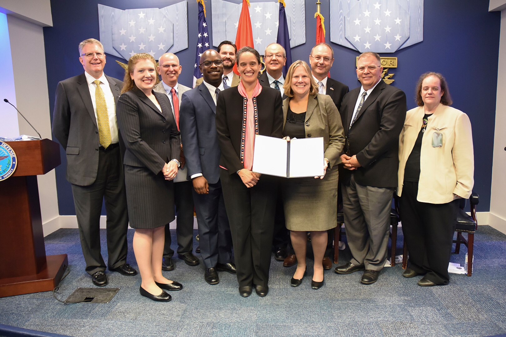 160801-N-RA705-001 WASHINGTON (Aug. 1, 2016) - Members of the AMNS-AF safety team receive the Secretary of the Navy Safety Excellence Award at the Pentagon. Pictured from left to right: Scott Tilden (Raytheon), Robyn Smith, Dave Chapman (Raytheon), Jarred Conley, Brandon Brown, Tracey Williams, Al Chester, Melissa Kirkendall, Phil Harrison (BAE), Andy Fuller, and Karen Cooper. 