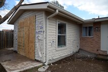 A storm containing 60 plus mph winds and golf ball sized hail hit Laughlin Air Force Base, Texas, at approximately 10:30 p.m. Feb. 22, 2016. With the storm came damaged facilities, housing units and personal property, to include hundreds of dented cars and homes. (U.S. Air Force photo by 2nd Lt. Hannah I. Crump)