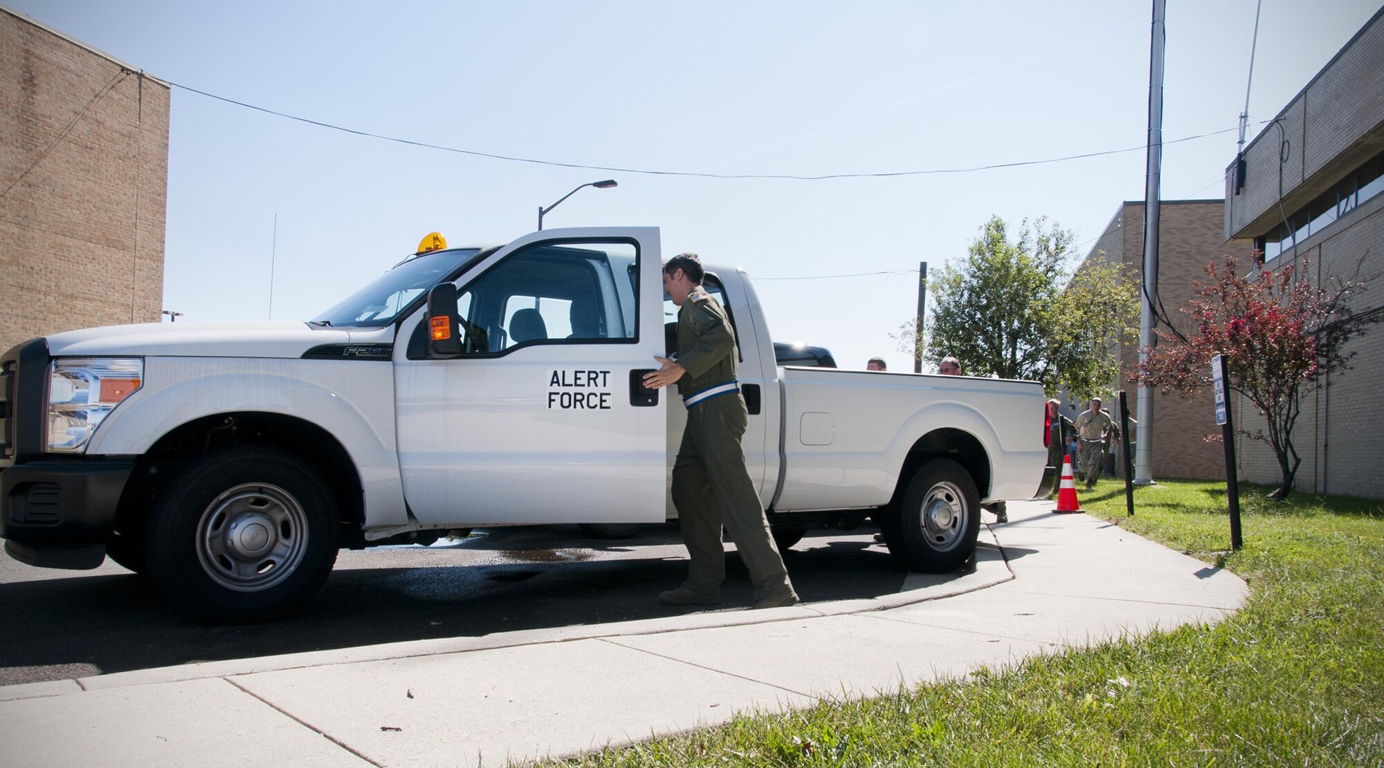 A member of the 756th Air Refueling Squadron enters an alert vehicle during a readiness exercise on Joint Base Andrews, Md., Sunday, Aug. 7, 2016. The exercise validates the unit’s readiness to execute its nuclear mission. (U.S. Air Force photo/Staff Sgt. Kat Justen)