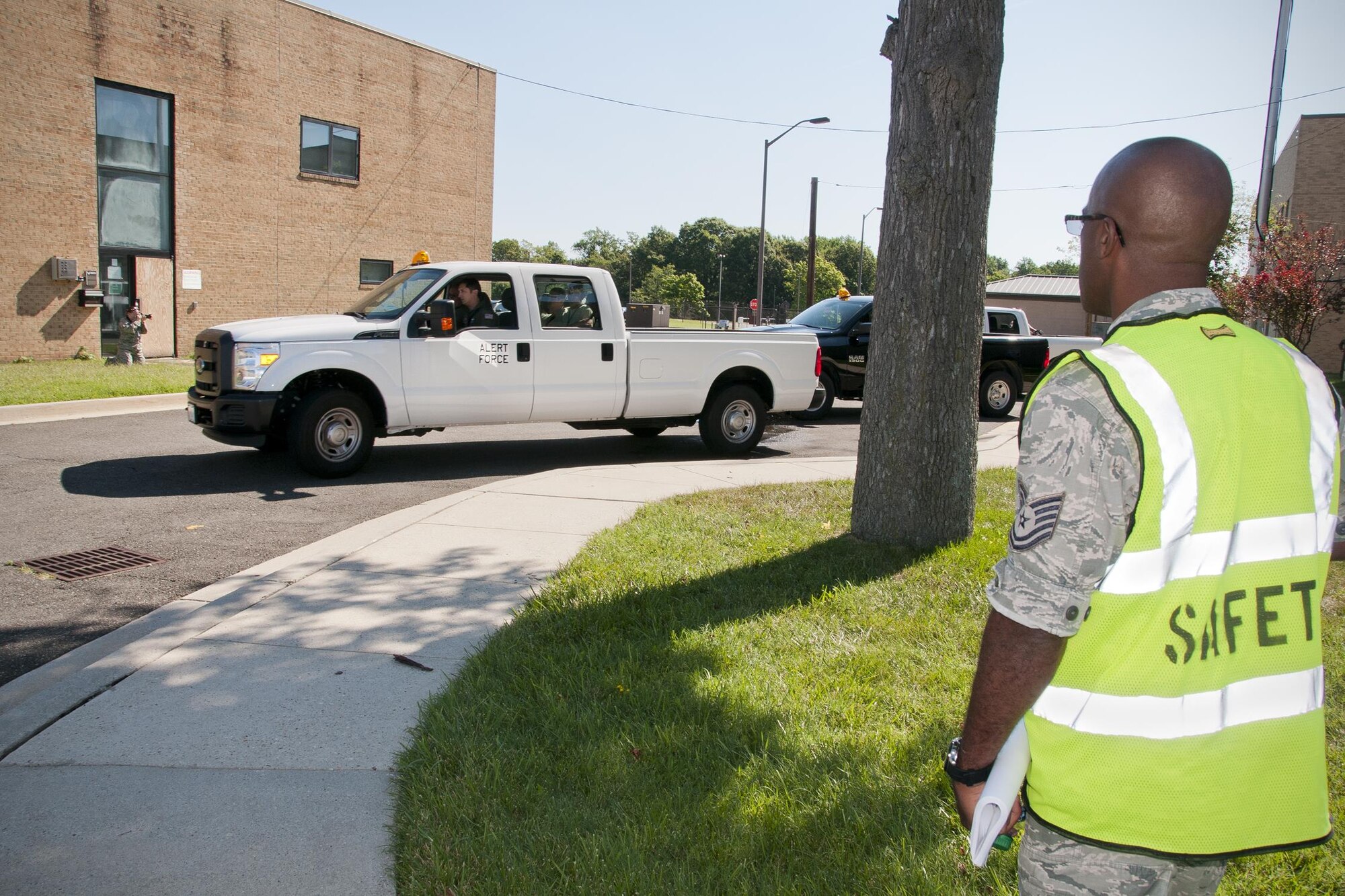 Tech. Sgt. Wendell Phillips, 459th Air Refueling Wing safety specialist, observes and inspects participants in a readiness exercise on Joint Base Andrews, Md., Sunday, Aug. 7, 2016. The exercise validates the unit’s readiness to execute its nuclear mission. (U.S. Air Force photo/Staff Sgt. Kat Justen)