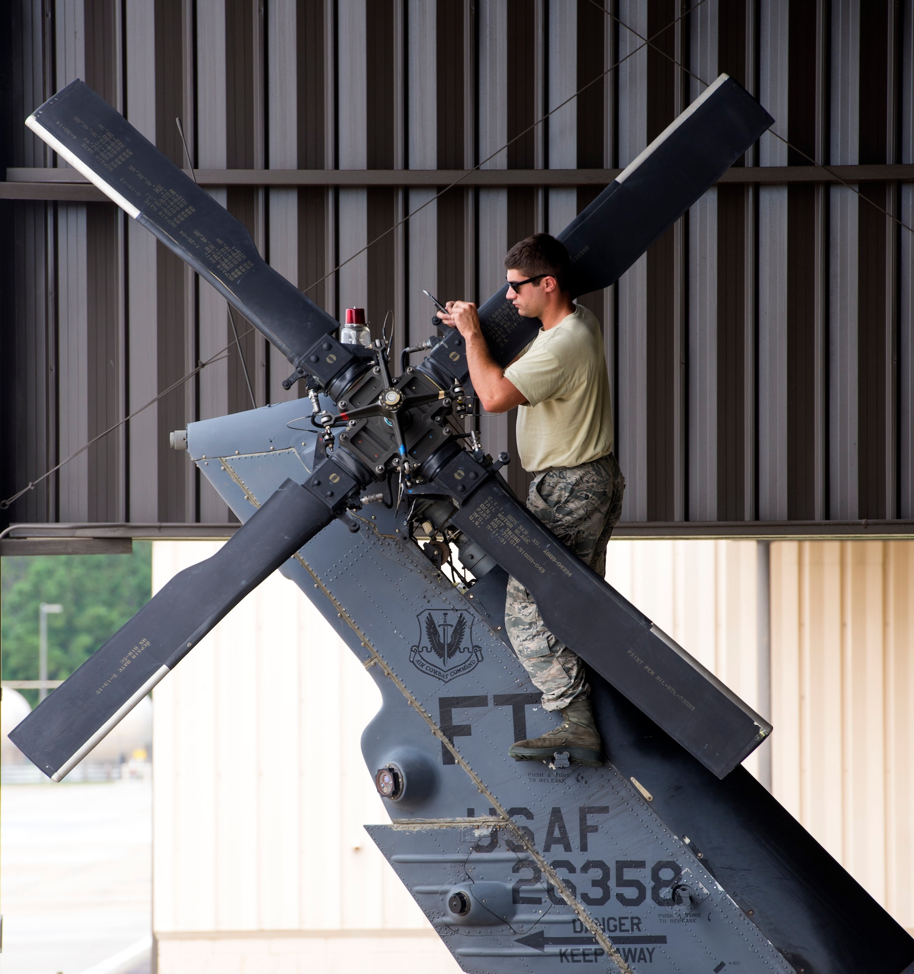 U.S. Air Force Senior Airman Anthony Staley, 41st Helicopter Maintenance Unit crew chief, cuts safety wire on the tail blade rotor of an HH-60G Pave Hawk, Aug. 10, 2016, at Moody Air Force Base, Ga. 41st HMU crew chiefs maintain, troubleshoot and inspect 13 HH-60’s in the 41st Rescue Squadron’s fleet. (U.S. Air Force photo by Airman 1st Class Greg Nash) 