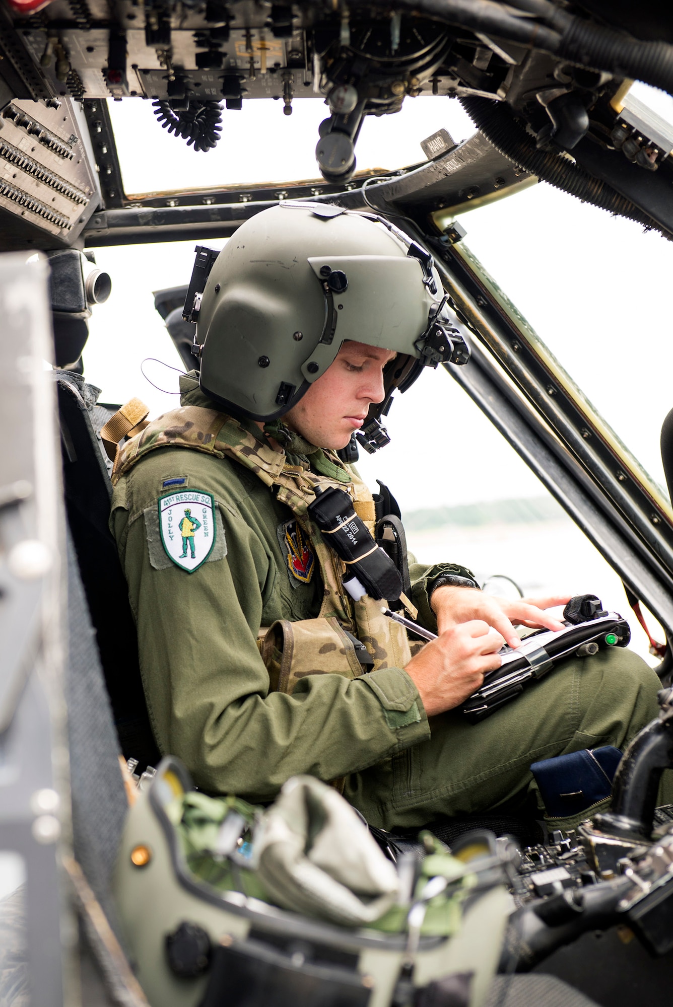 A 41st Rescue Squadron HH-60G Pave Hawk pilot records data during a pre-flight inspection, Aug. 10, 2016, at Moody Air Force Base, Ga. The 41st RQS pilots rely on the 41st Helicopter Maintenance Unit’s crew chiefs to locate and diagnose potential helicopter component discrepancies during pre-flight inspections. (U.S. Air Force photo by Airman 1st Class Greg Nash)