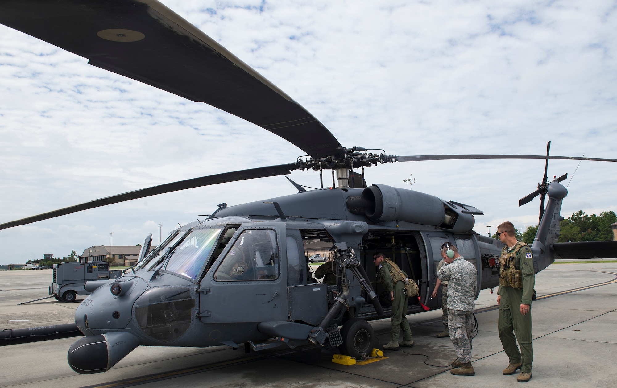 U.S. Air Force crew chiefs from the 41st Helicopter Maintenance Unit assist aircrew members from the 41st Rescue Squadron, during an HH-60G Pave Hawk’s pre-flight inspection, Aug. 10, 2016, at Moody Air Force Base, Ga. 41st HMU crew chiefs are responsible for ensuring HH-60s are ready to fly at a moment’s notice. (U.S. Air Force photo by Airman 1st Class Greg Nash)