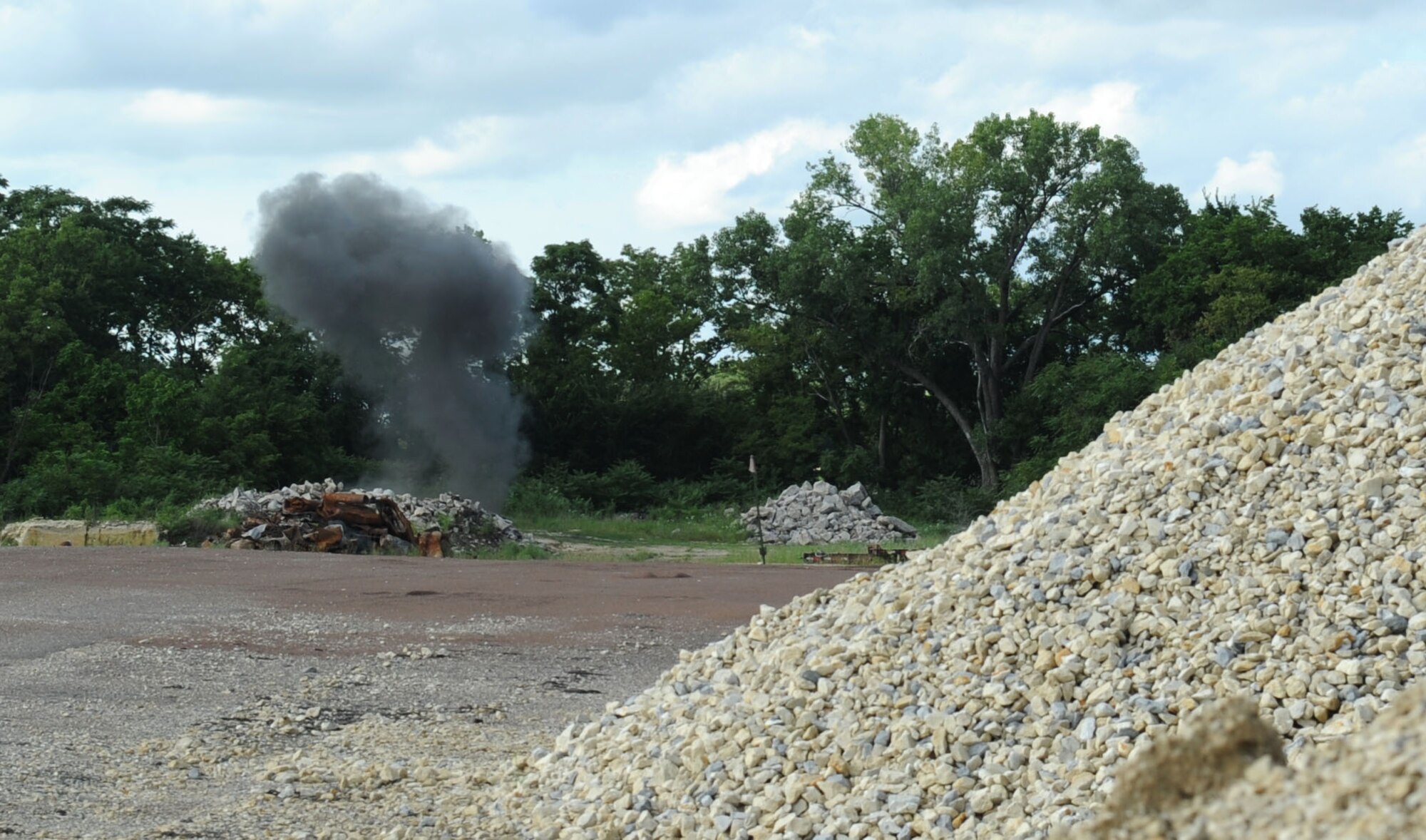 A plume of smoke rises into the air after 22nd Civil Engineer Squadron explosive ordnance disposal technicians detonate munitions in order to dispose of an artillery projectile Aug. 8, 2016, in Marion County, Kan. The Marion County Sherriff’s department contacted McConnell’s EOD team after an individual turned in a potentially dangerous explosive device. (U.S. Air Force photo/ Senior Airman Tara Fadenrecht)